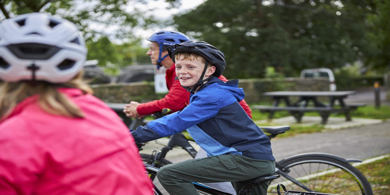 children resting on bikes