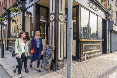 Arthur's Pub, Thomas St, The Liberties Courtesy Failte Ireland two women walking passed a pub