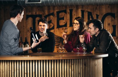 Tasting whiskey at Teeling Distillery 3 people tasting whiskey with barman